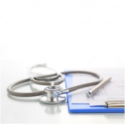 a stethoscope next to a clipboard