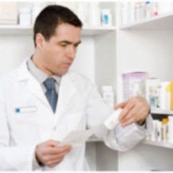 a doctor reading a pill bottle