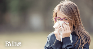 a woman sneezing