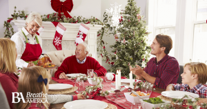 a family eating dinner at christmas