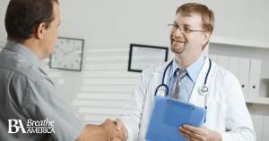 a doctor shaking a patient's hand